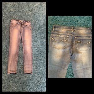 Distressed/faded looking jeans. Great condition.